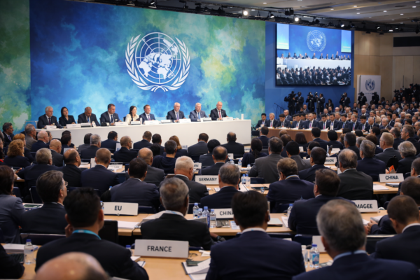 World leaders attending international climate negotiations focused on emissions reduction and climate finance
