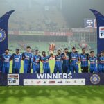 India cricket team celebrating T20 World Cup victory with trophy in stadium