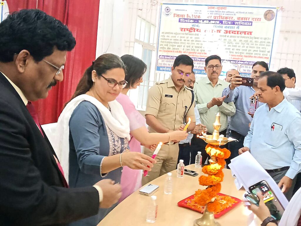 Lok Adalat inauguration ceremony at Buxar Civil Court with judicial officers lighting the ceremonial lamp