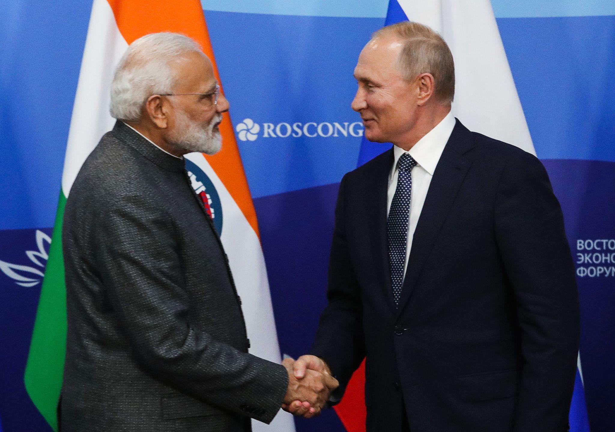 Indian and Russian flags displayed during a diplomatic meeting symbolizing the strategic partnership between the two countries.