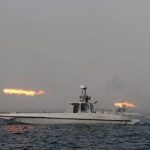 Oil tanker traveling through the Strait of Hormuz under heightened maritime security conditions.