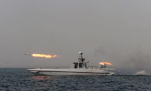 Oil tanker traveling through the Strait of Hormuz under heightened maritime security conditions.