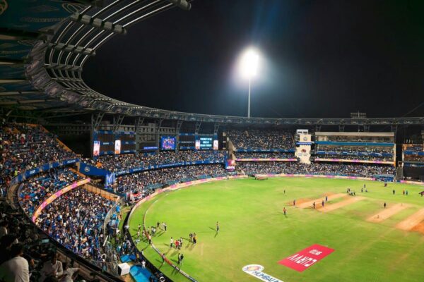 IPL cricket match stadium night lights crowd action