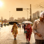 India heatwave 2026 with people facing extreme summer temperatures in a city street