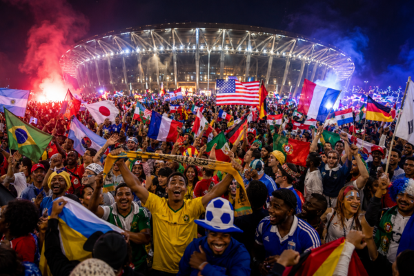 FIFA World Cup 2026 global fan celebration with flags, stadium lights and football festival atmosphere