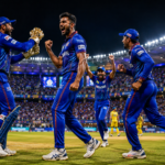 Packed cricket stadium during a high-pressure IPL match with players celebrating a crucial wicket.