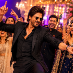 Bollywood superstar-style figure dancing at a glamorous wedding celebration with guests cheering.